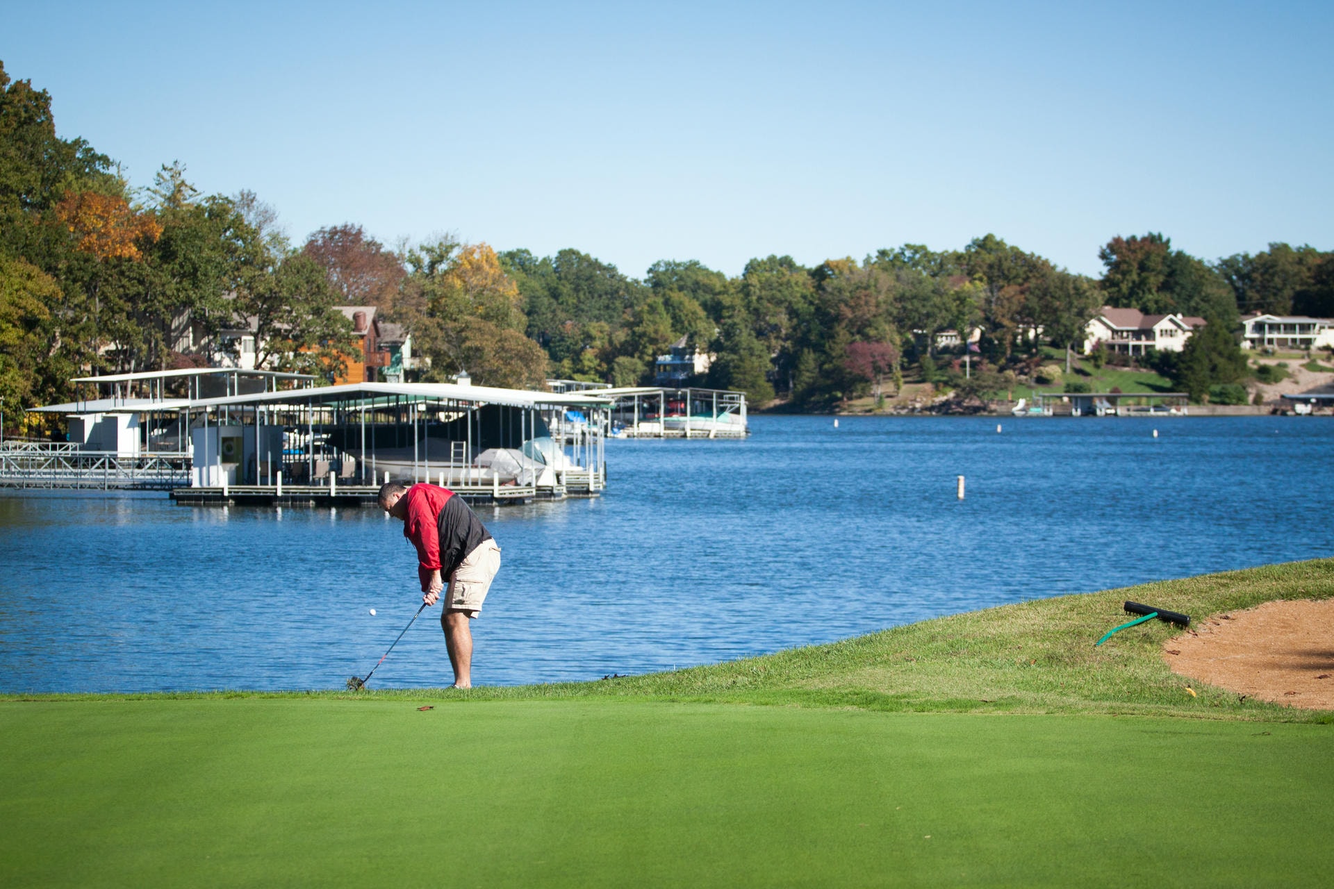 Golfer playing a round lakeside